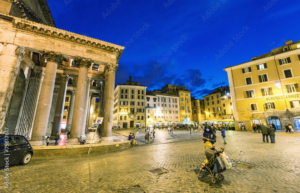 ROME - MAY 18, 2014: Tourists walk in Pantheon Square at night.
