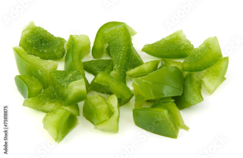 Chopped green pepper on white background.