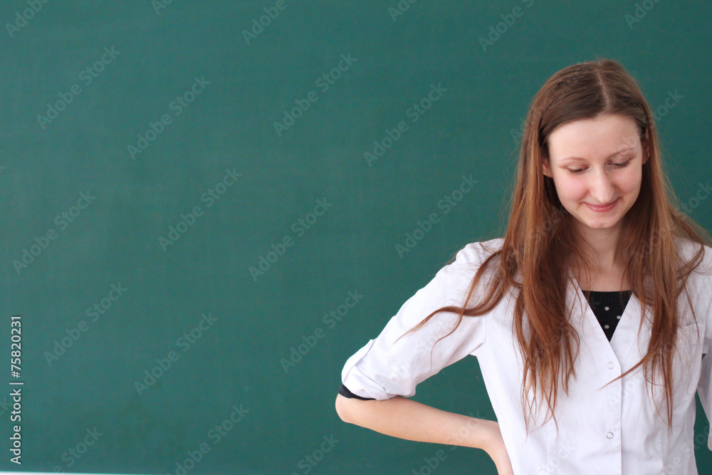 Close up portrait of shy medical student smiling Close up portrait of shy medical student smiling