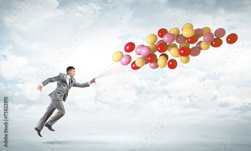 Businessman with balloons