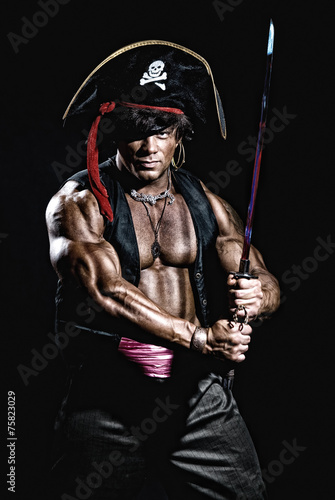 Muscular man in a pirate costume.