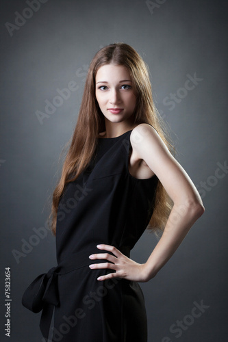 Portrait of long-haired model posing at camera