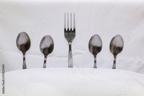 Spoons and forks  small spoons on a white background