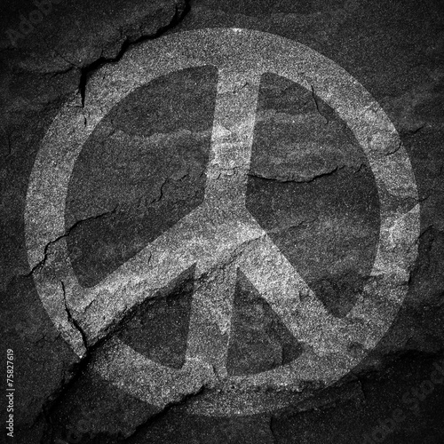 Peace sign grunge background textured on stone wall