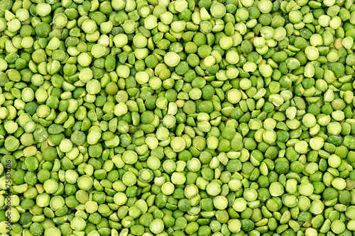 Macro background texture of vibrant green split peas