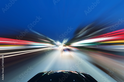 A car driving on a motorway at high speeds