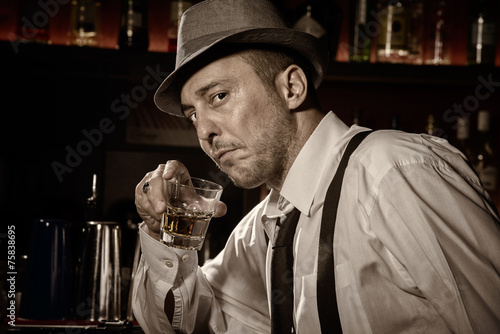 Vintage portrait of a man drinking at a bar