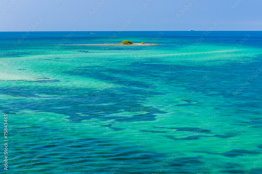 Water of tropical sea and tiny coral reef on background Water of tropical sea and tiny coral reef on background
