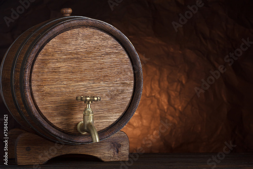 Beer barrel on wooden table still-life with copy space