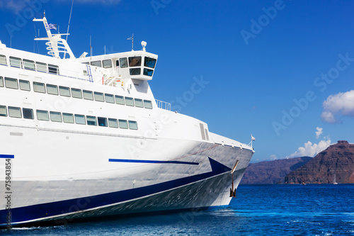 Modern cruise ship sailing on Aegean sea  Santorini Greece.
