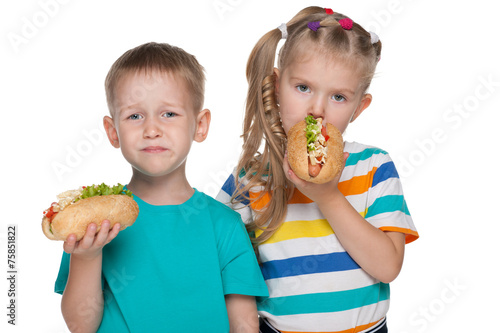Two children with hot dogs