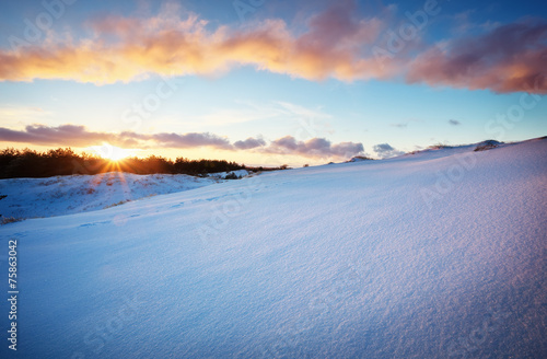 Beautiful winter landscape with sunset sky © es0lex