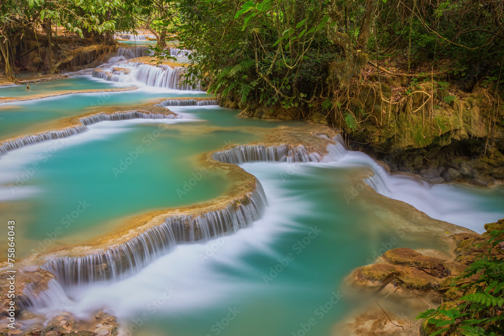 Kuang Si waterfall with blue minerals water Kuang Si waterfall with blue minerals water