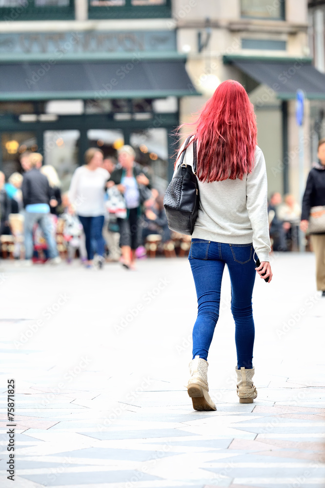Young shopping women crossing square Young shopping women crossing square