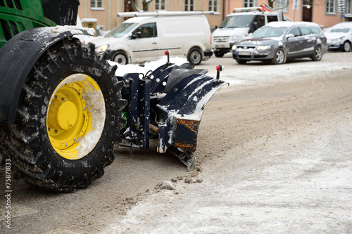 Close up of snow plow on street.