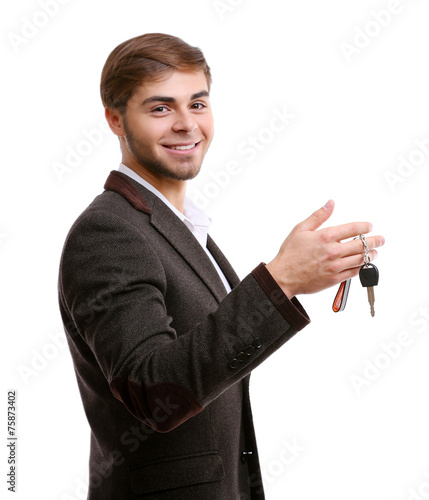 Businessman holding car key...