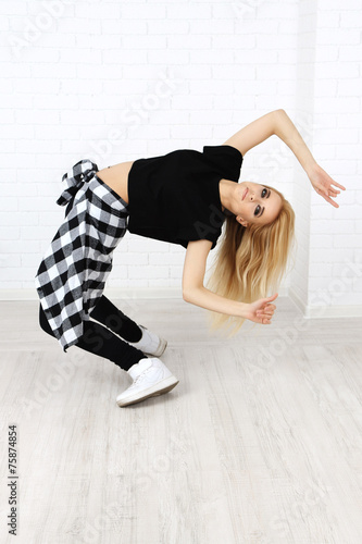 Hip hop dancer dancing on w...
