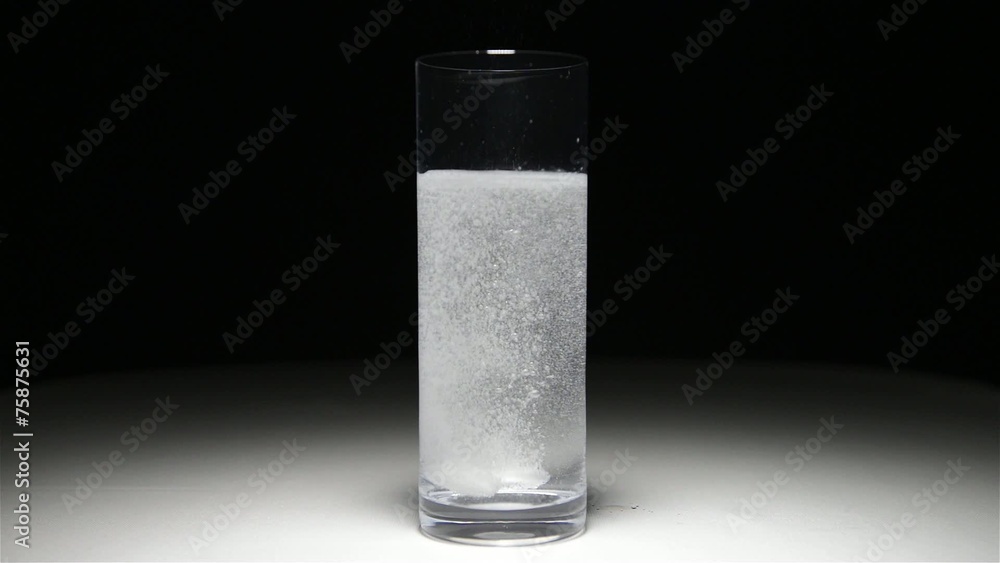 glass with water and a pills glass with water and a pills