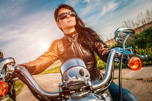 Biker girl on a motorcycle