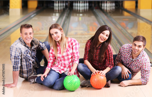 Portrait of friends in bowling club