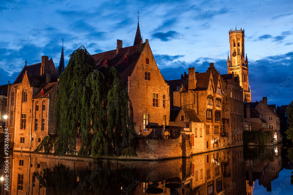 Buildings on canal at night in Bruges, Belgium Buildings on canal at night in Bruges, Belgium