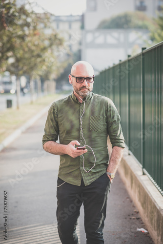 handsome middle aged man listening to music