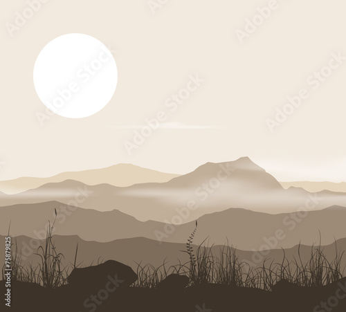 Landscape with grass and mountains over sunset.