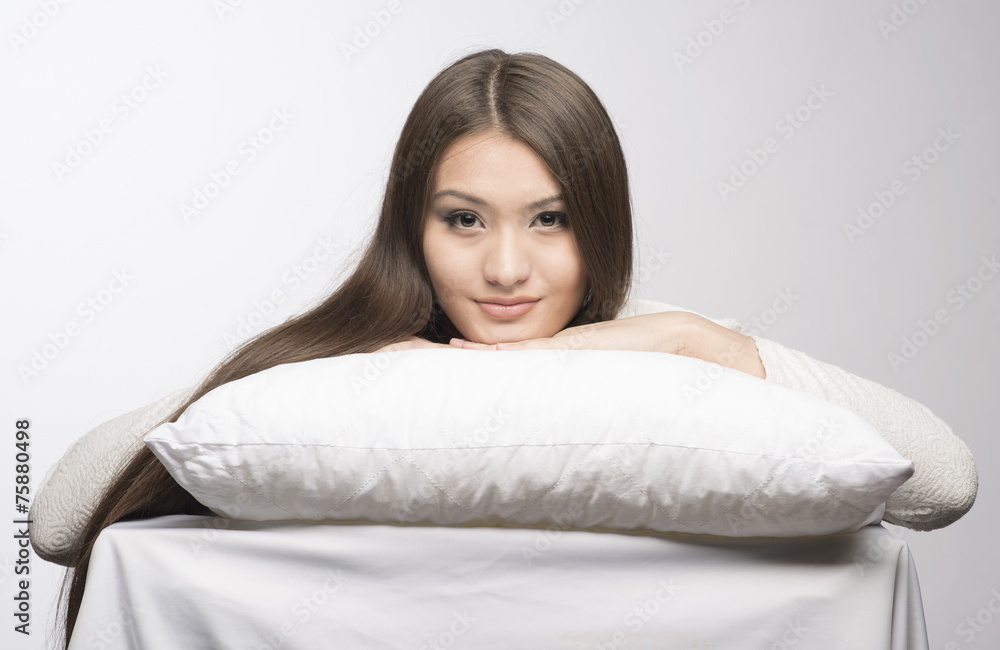 beatiful girl head on a pillow and table beatiful girl head on a pillow and table