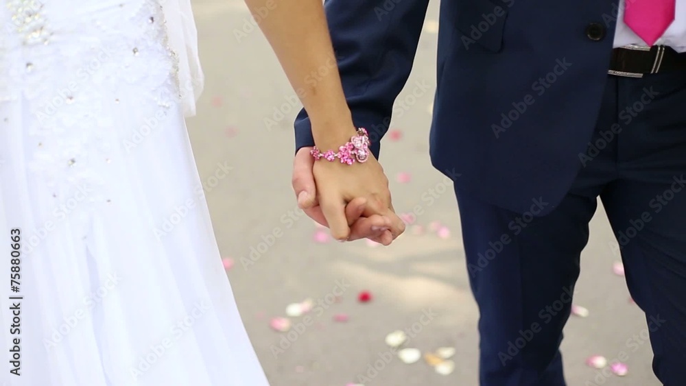 the couple hold hands the couple hold hands