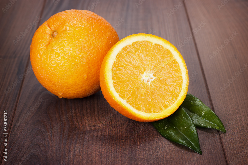 fresh oranges on brown wooden table fresh oranges on brown wooden table