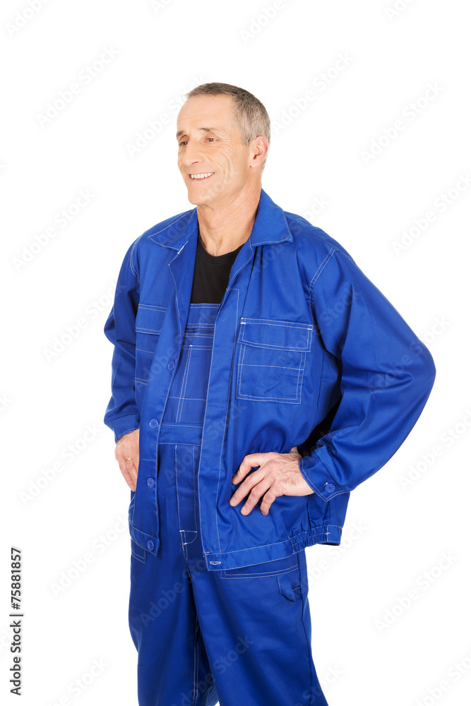 Smiling repairman with hands on hips Smiling repairman with hands on hips