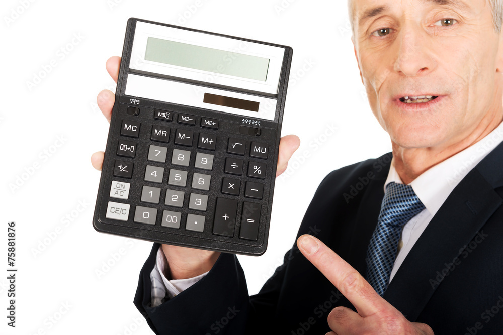 Happy businessman pointing on calculator Happy businessman pointing on calculator
