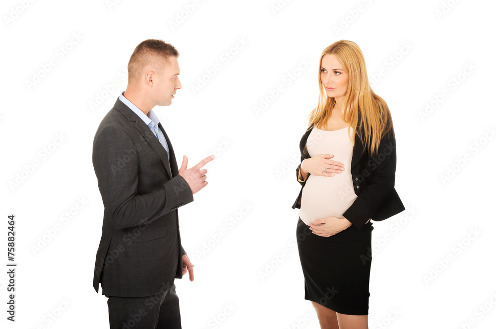 Pregnant businesswoman talking with her partner Pregnant businesswoman talking with her partner