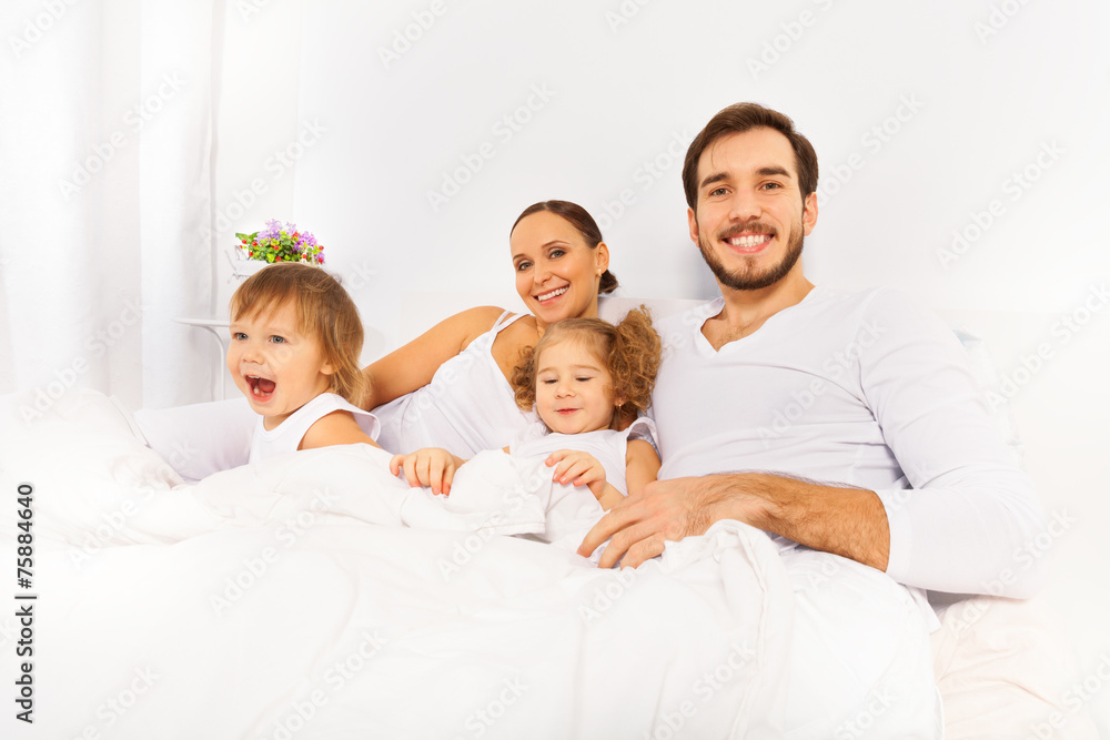 Father, mother and two kids in the morning
