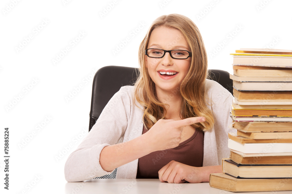Young woman with a books pile Young woman with a books pile