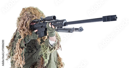 Army sniper wearing a ghillie suit photo