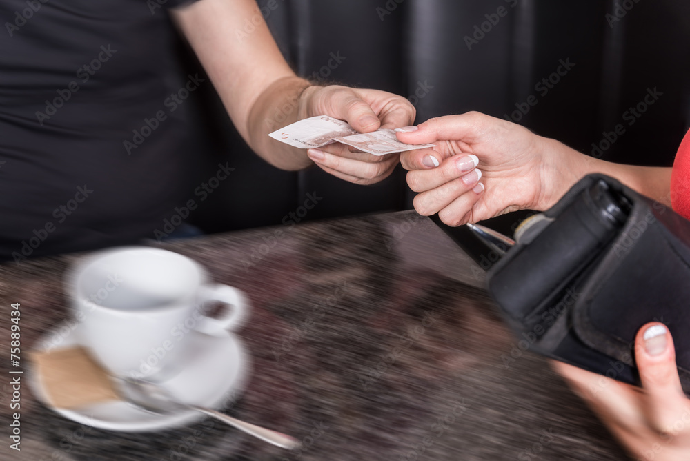 Paying the bill at the coffee shop Paying the bill at the coffee shop