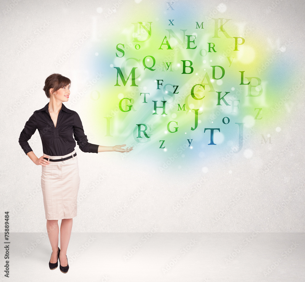 Business women with glowing letter concept Business women with glowing letter concept