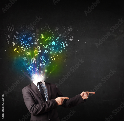 Business man with glowing media icons exploding head