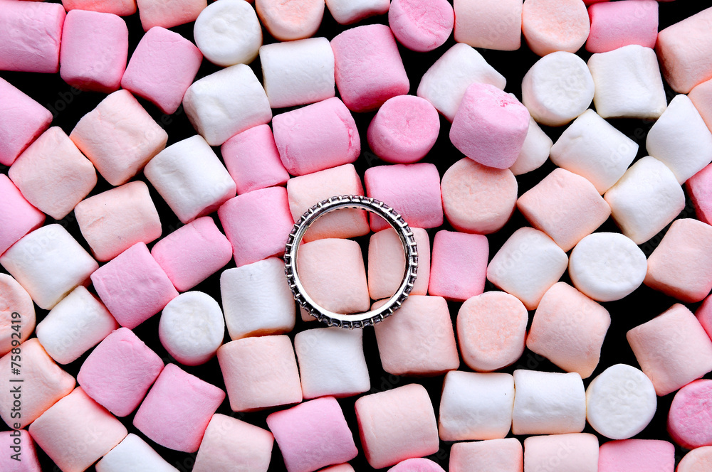 wedding ring on pink and white mini marshmallows wedding ring on pink and white mini marshmallows