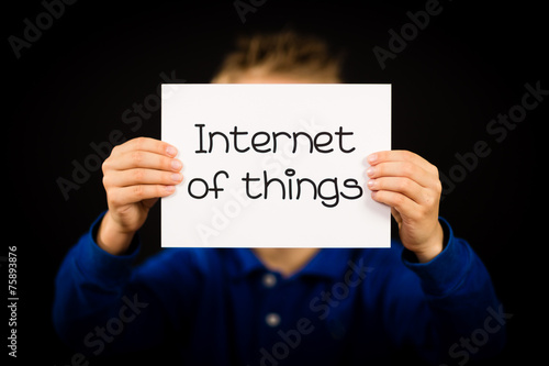 Child holding Internet of Things sign