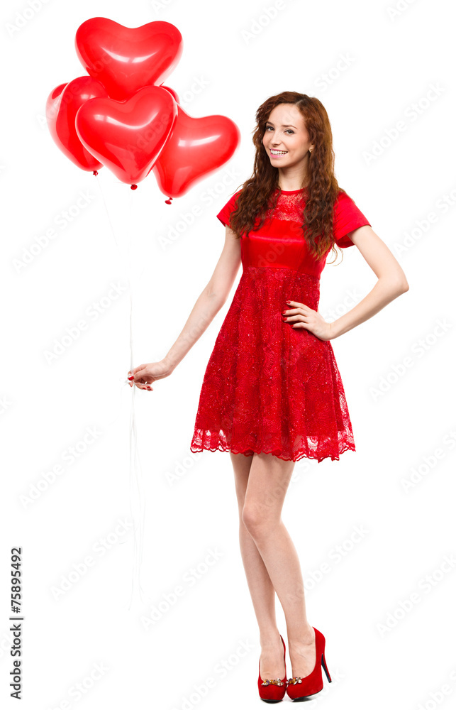 Young woman holding heart-shaped balloons Young woman holding heart-shaped balloons