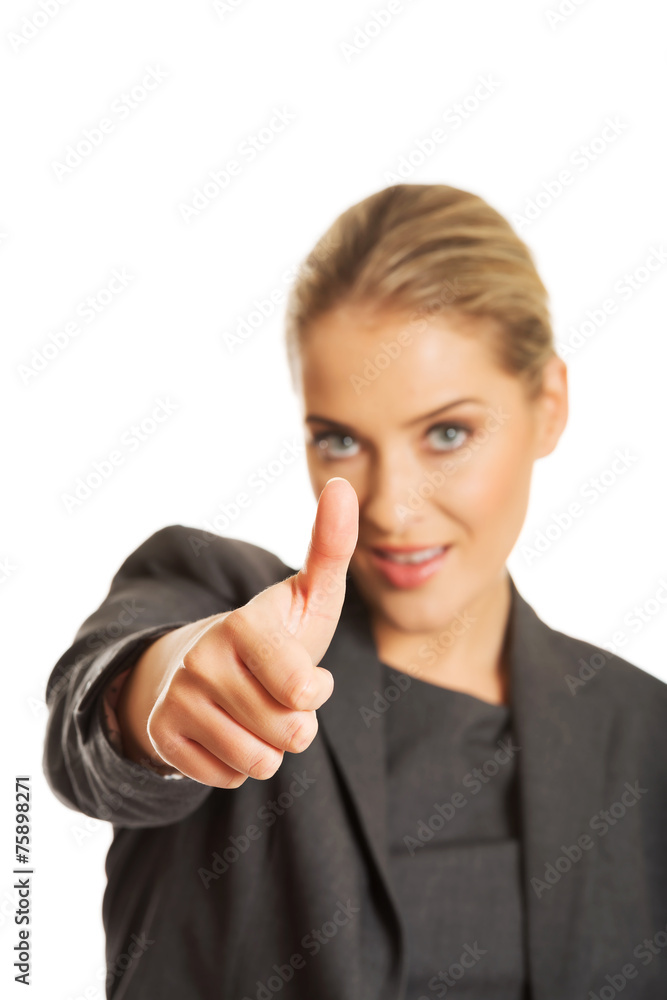 Businesswoman with thumbs up gesture Businesswoman with thumbs up gesture