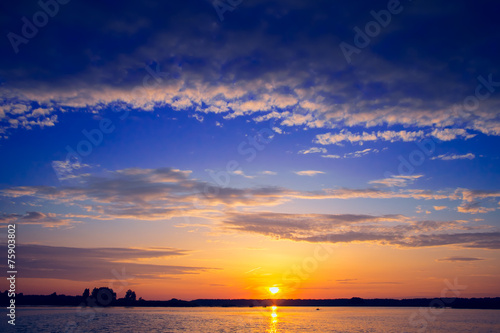 Amazing sunset over lake © Goinyk