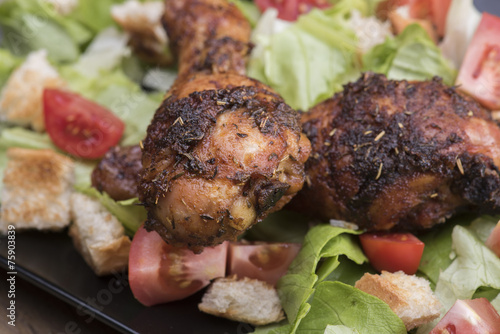 Spicy chicken legs with salad