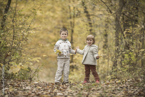 Children playing in a forest © skyfotostock