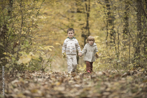 Children playing in a forest