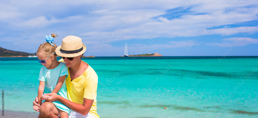 Young father and little daughter during tropical beach vacation