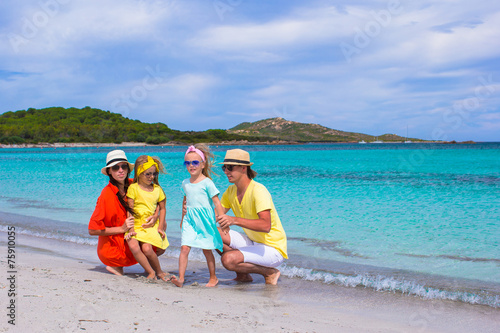 Happy family during summer beach vacation