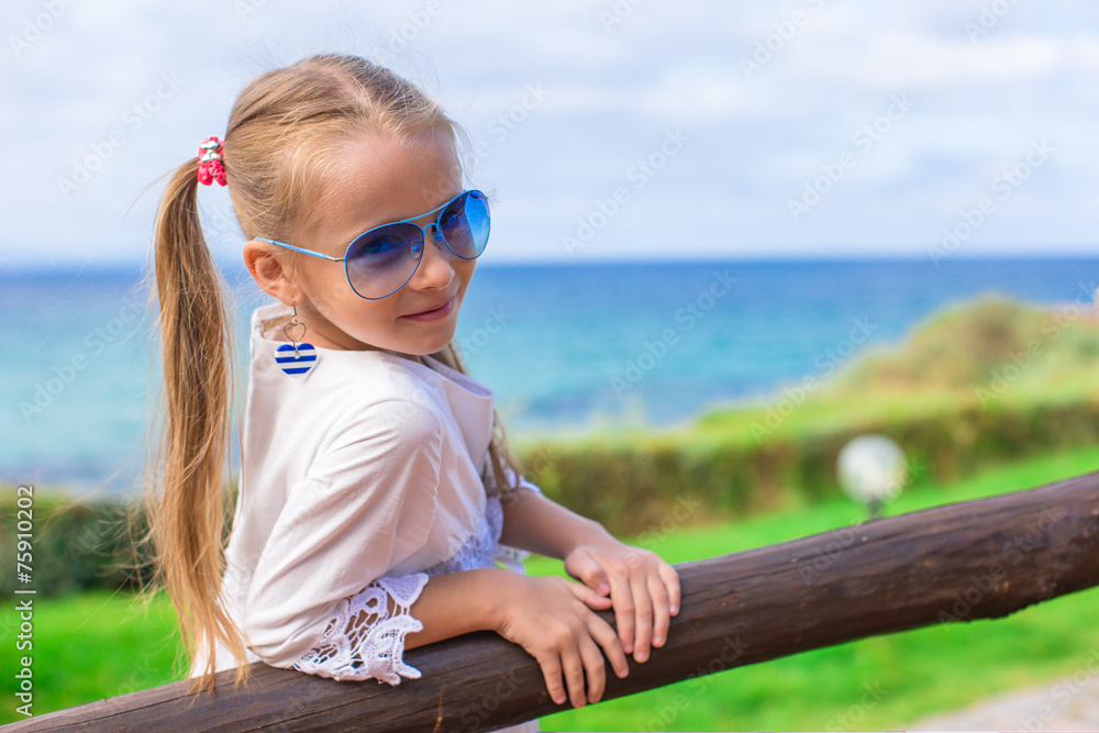 Adorable little girl outdoors during summer vacation
